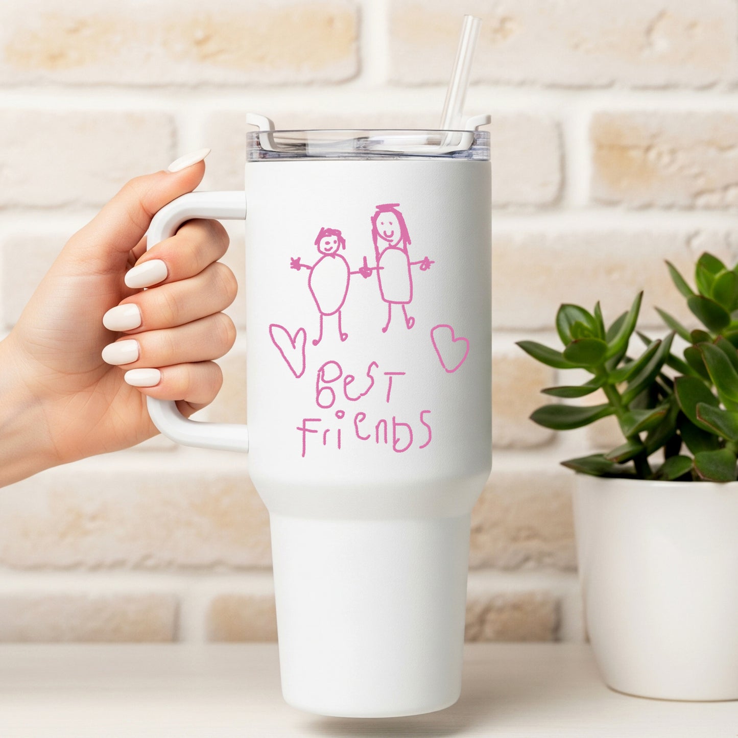 White mug with 'Best Friends' design held by a hand, against a light brick wall background. | Little Heirloom