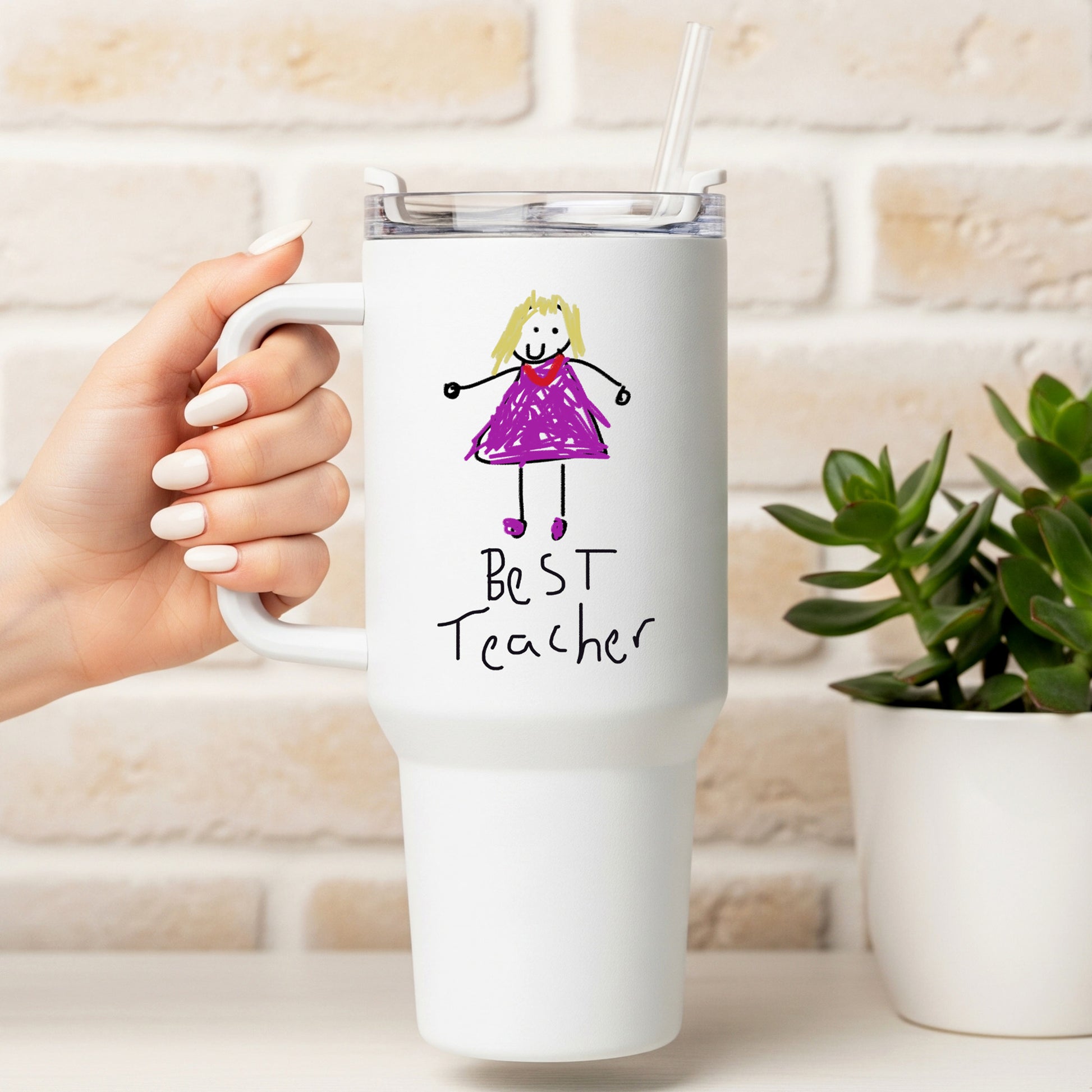 White travel mug with a drawing of a girl in a purple dress and 'Best Teacher' text, held by a hand. | Little Heirloom