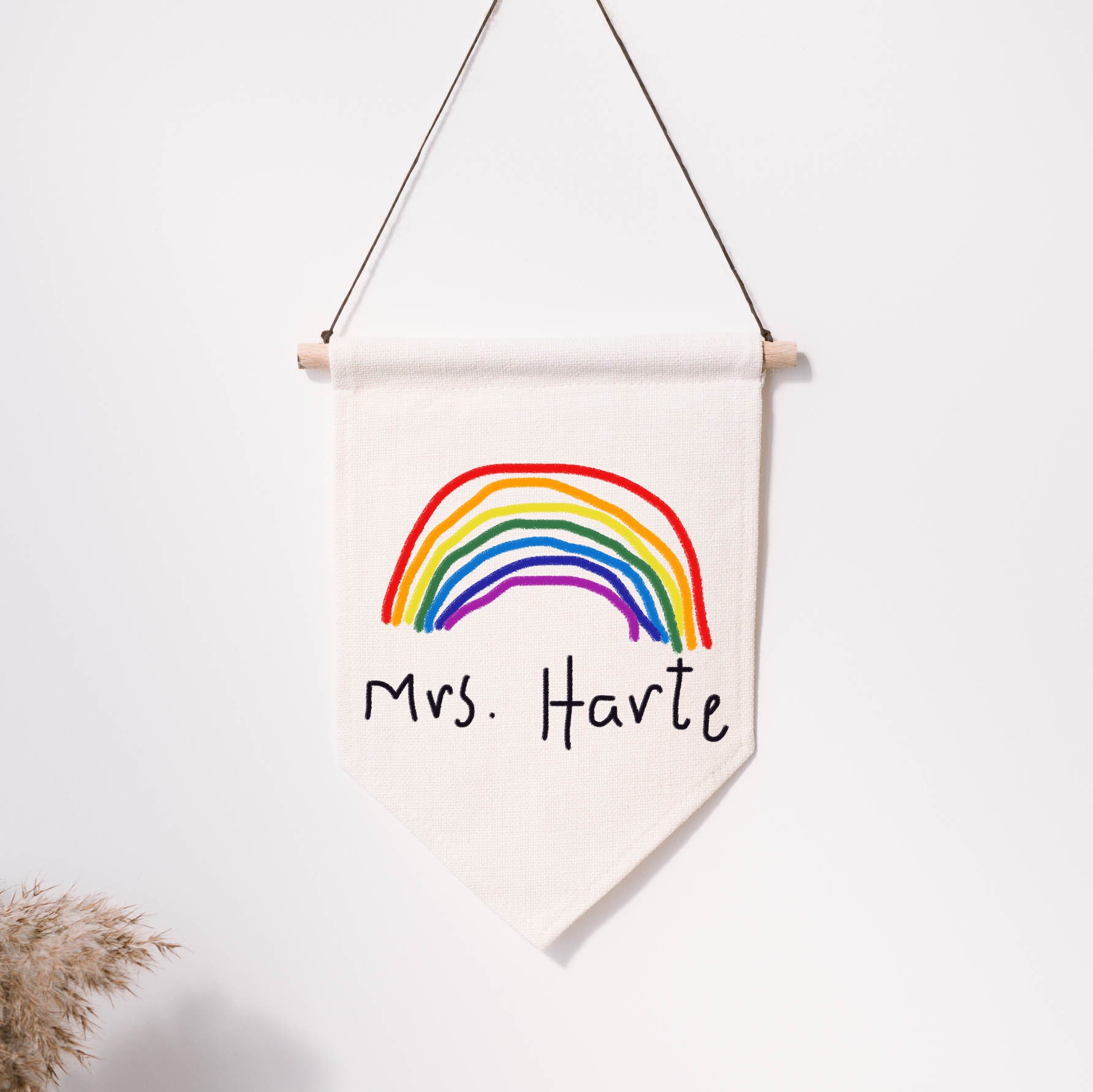 Canvas wall hanging with a rainbow and text 'Mrs. Harte' on a white background | Little Heirloom