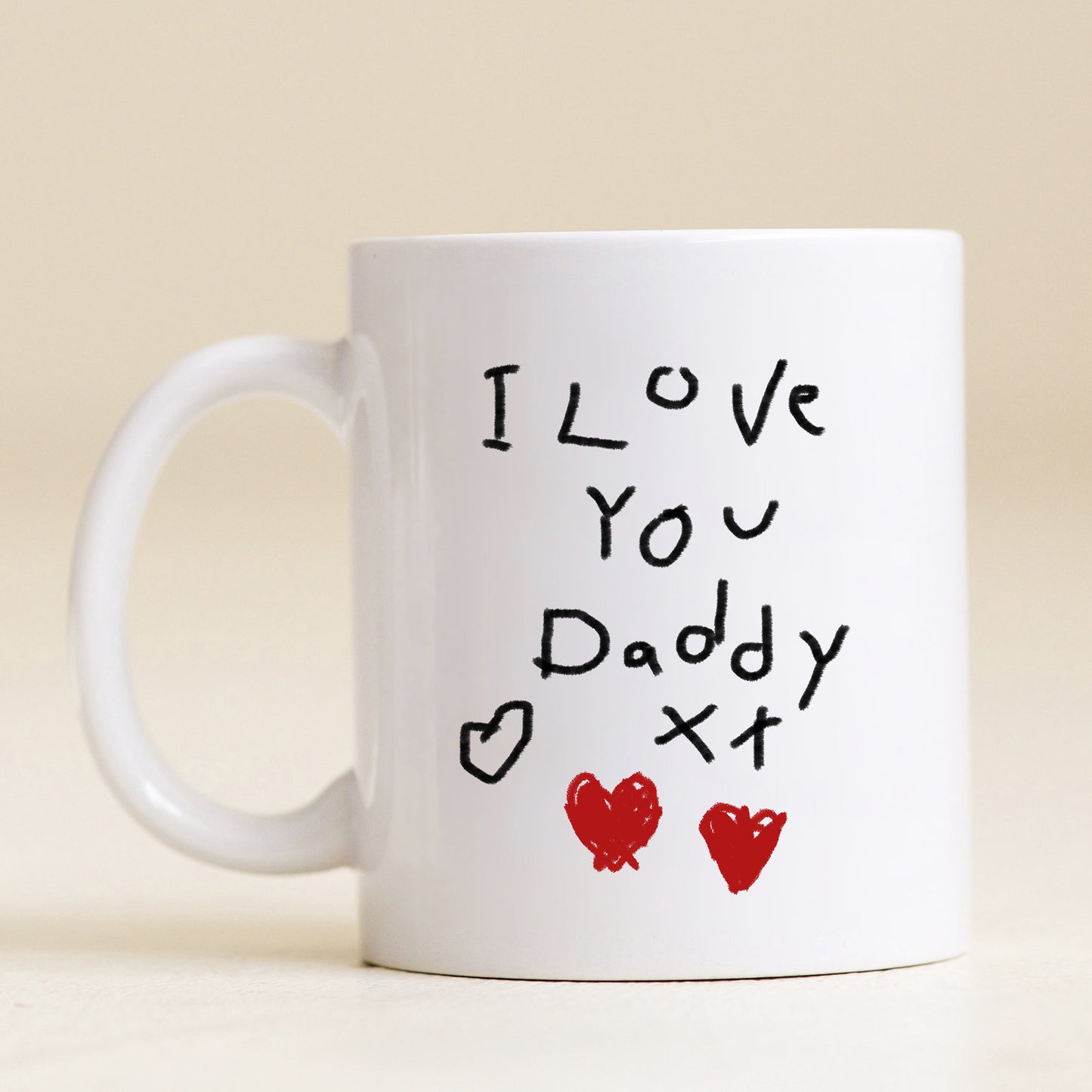 White mug with 'I Love You Daddy' text and heart designs on a beige background | Little Heirloom