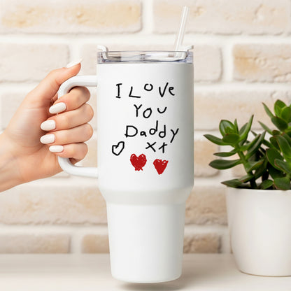 White mug with 'I Love You Daddy' text held by a hand, against a light brick wall. | Little Heirloom