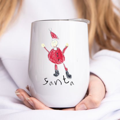 White tumbler with a drawing of Santa Claus held by a person | Little Heirloom