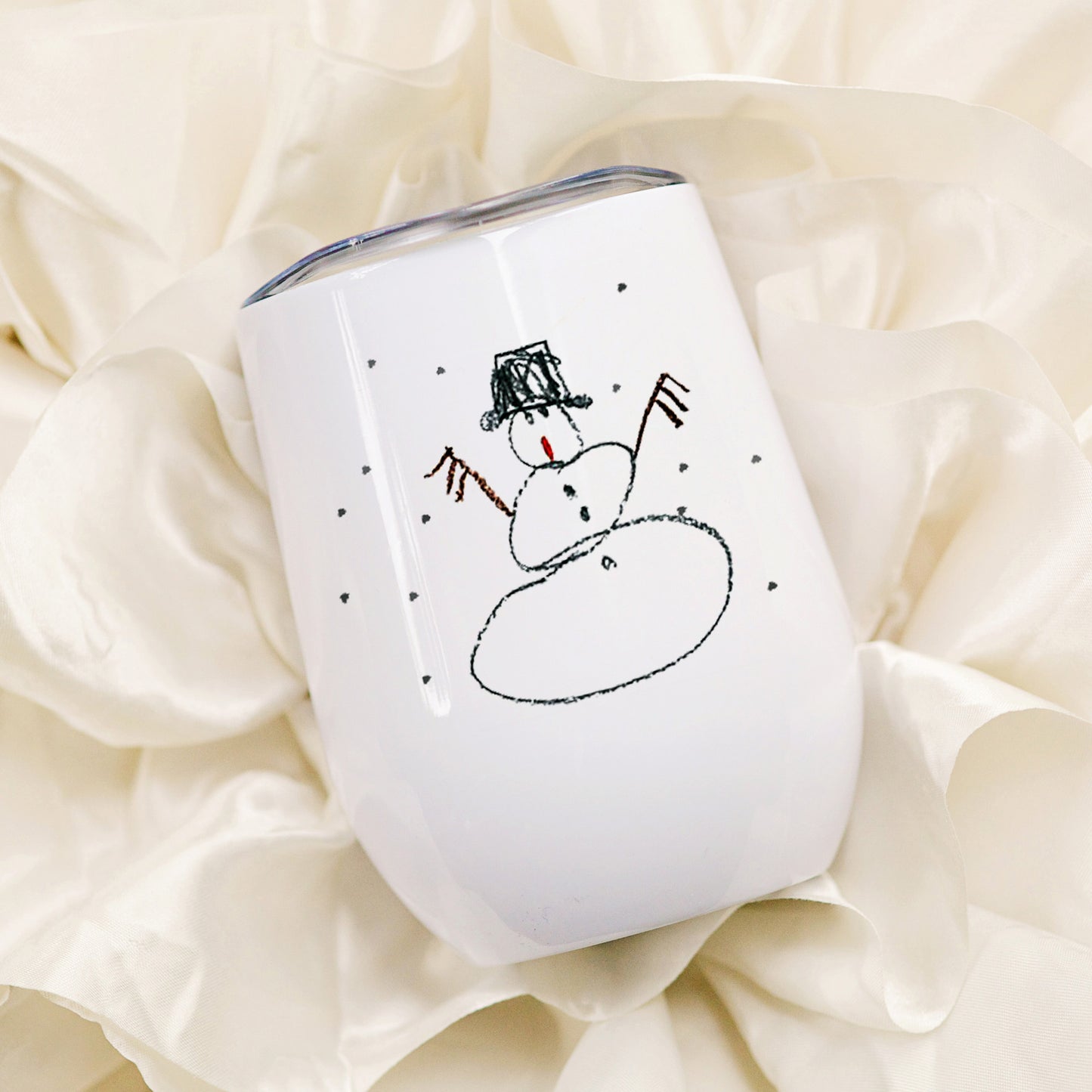 White tumbler with a snowman design on a soft beige background | Little Heirloom